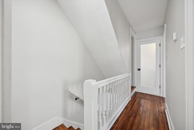 corridor featuring dark hardwood / wood-style floors