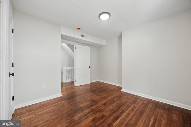 empty room featuring dark hardwood / wood-style floors