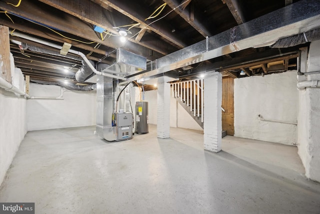 basement with electric water heater and heating unit