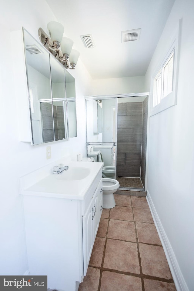 full bathroom featuring a shower stall, toilet, and visible vents