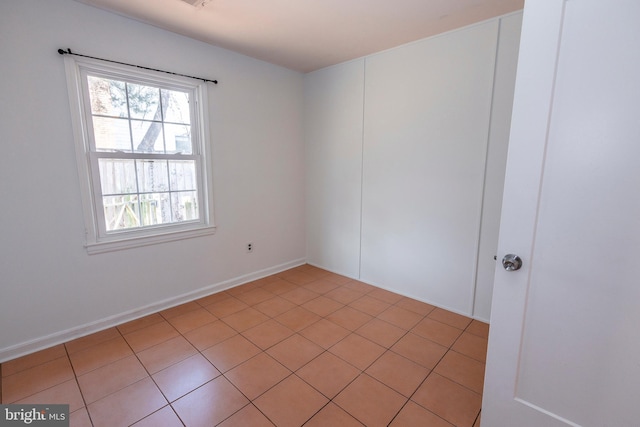 spare room with light tile patterned floors