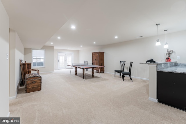 playroom featuring light carpet and french doors