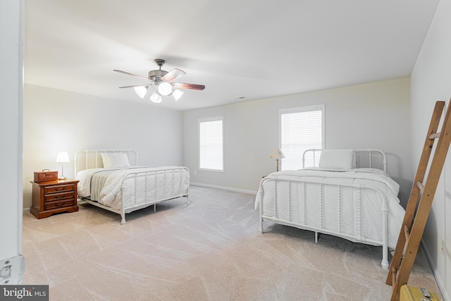 bedroom with light carpet and ceiling fan