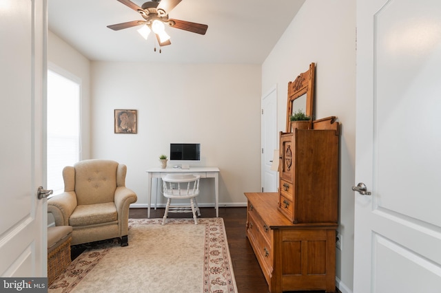 office area featuring dark hardwood / wood-style floors and ceiling fan