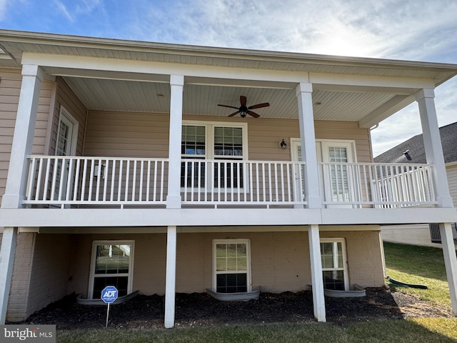 rear view of property with ceiling fan