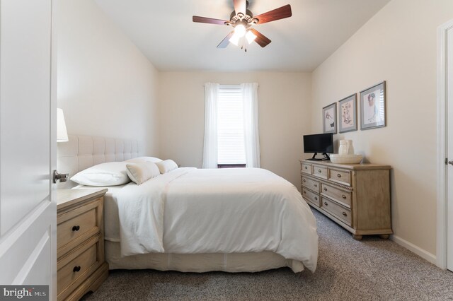 bedroom with light colored carpet and ceiling fan