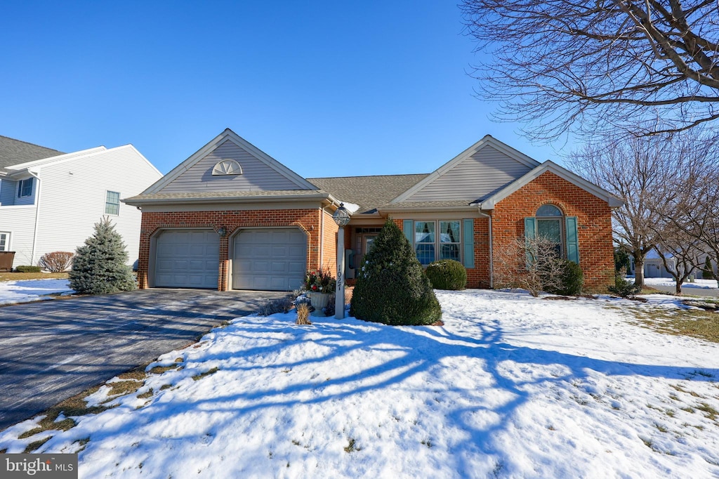 single story home featuring a garage