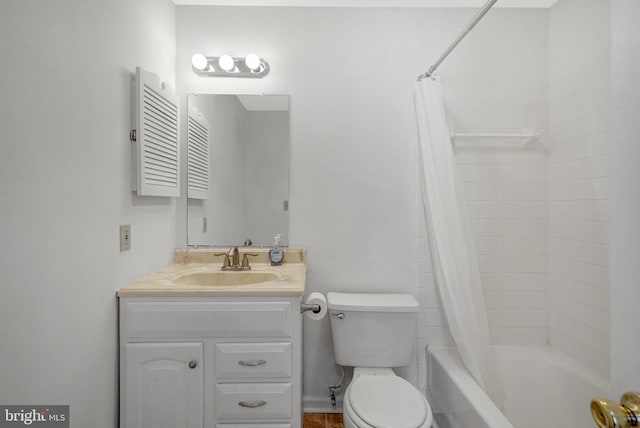 bathroom featuring toilet, shower / bath combo, and vanity