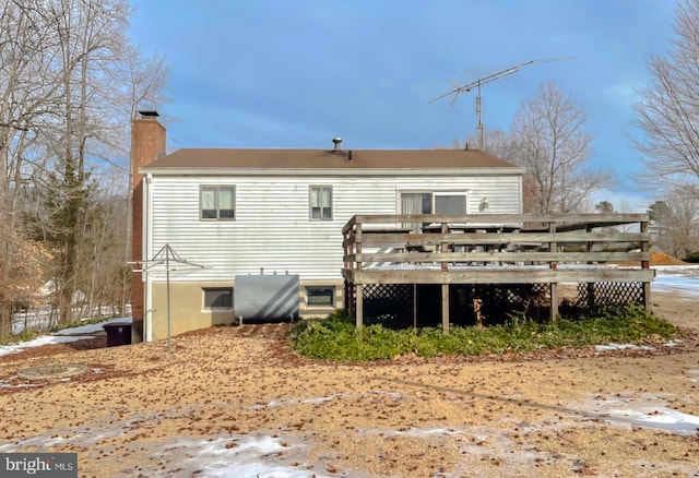 rear view of house with a wooden deck