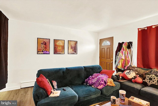 living room featuring hardwood / wood-style flooring and a baseboard radiator