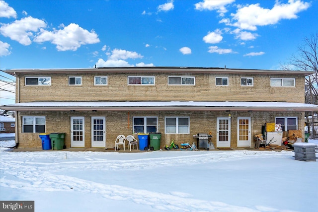 view of snow covered house