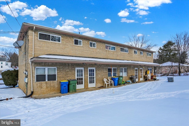 view of snow covered house