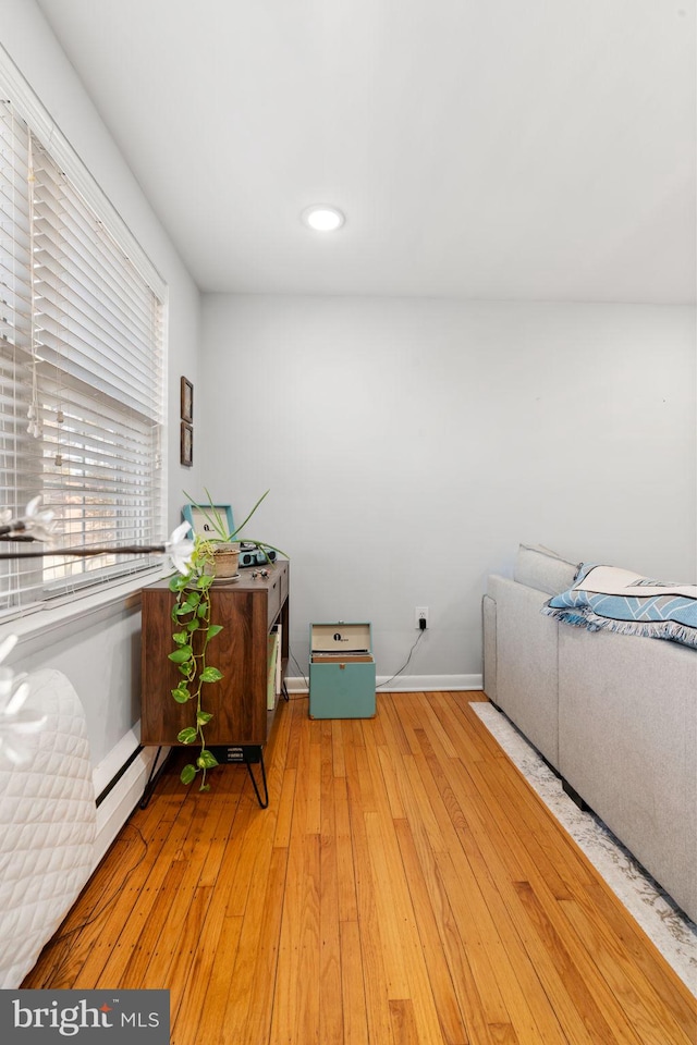 laundry room with hardwood / wood-style flooring