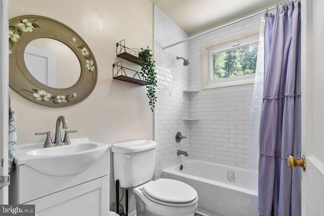 full bathroom with vanity, shower / bath combo, and toilet