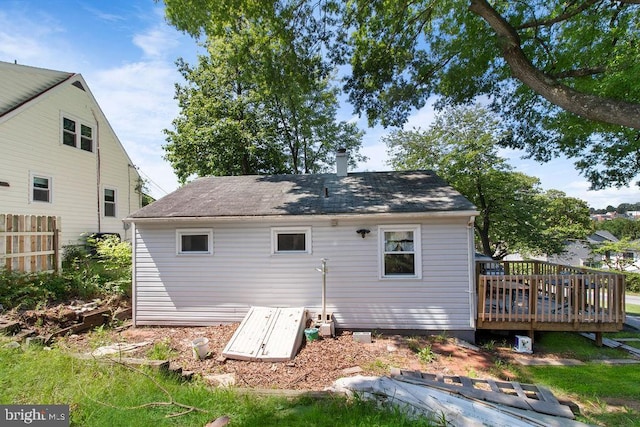 rear view of property with a wooden deck