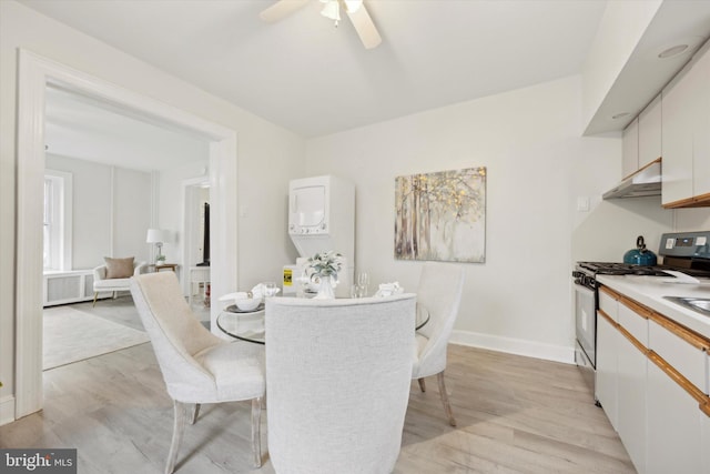 dining space featuring light hardwood / wood-style flooring and ceiling fan