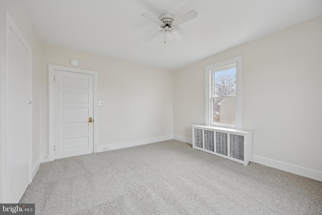 unfurnished room with ceiling fan and carpet floors