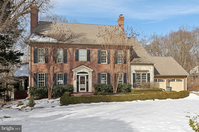 colonial inspired home featuring a garage