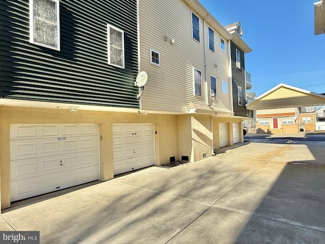 view of side of property featuring a garage