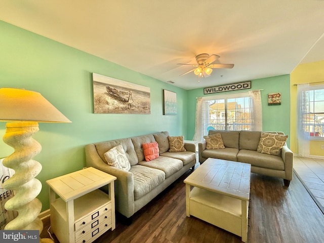 living room featuring dark hardwood / wood-style floors and ceiling fan