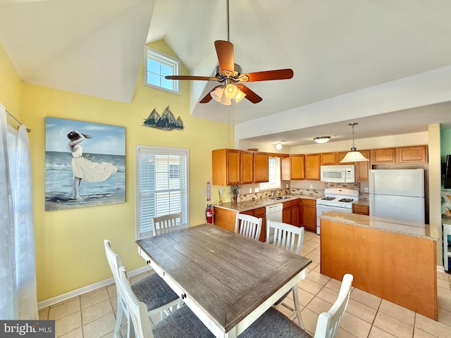 dining room with high vaulted ceiling, sink, light tile patterned floors, and ceiling fan