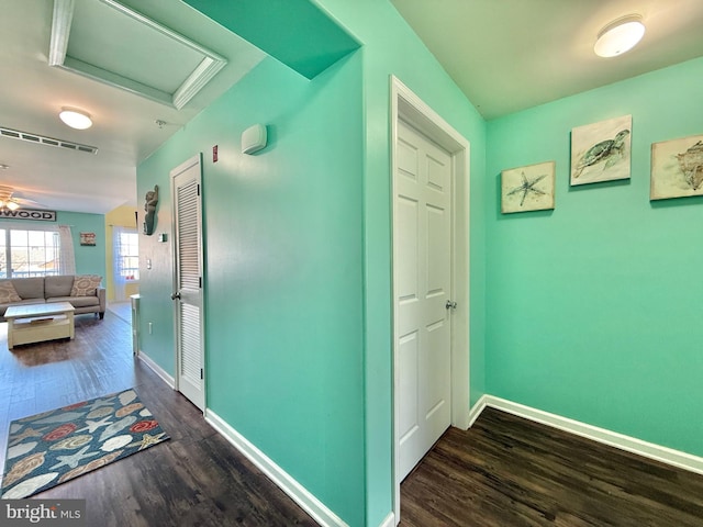 hall with dark wood-type flooring