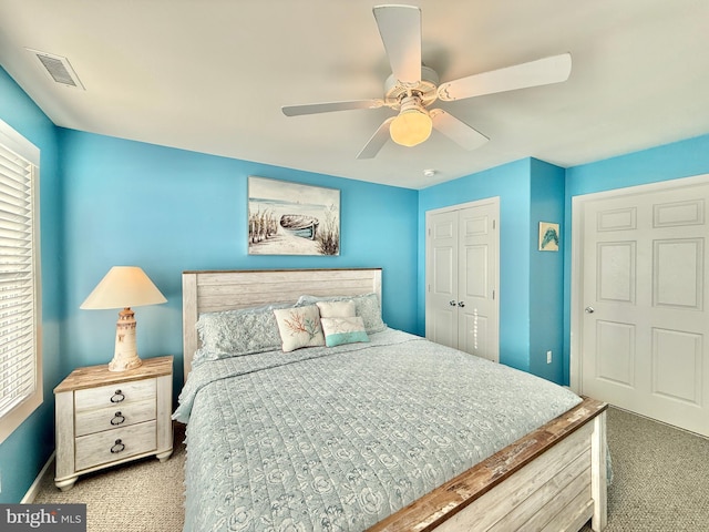 bedroom with carpet flooring, ceiling fan, and a closet