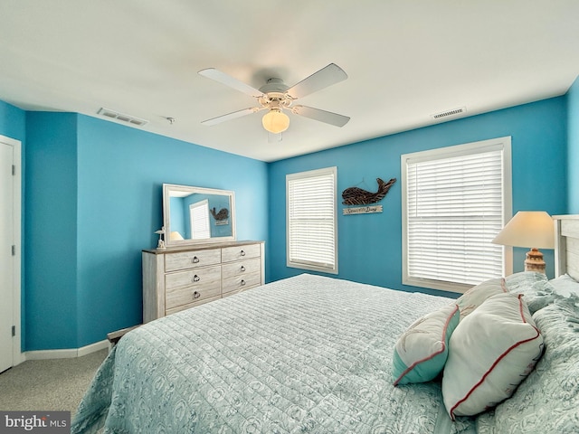 bedroom with light colored carpet and ceiling fan