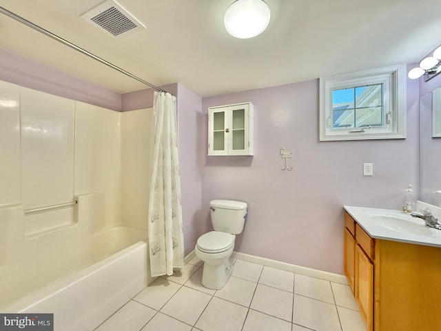 full bathroom with tile patterned flooring, toilet, vanity, and shower / bath combo with shower curtain