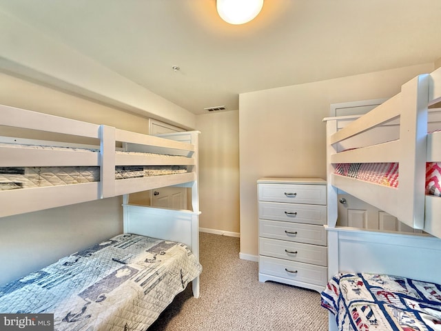 bedroom featuring light carpet