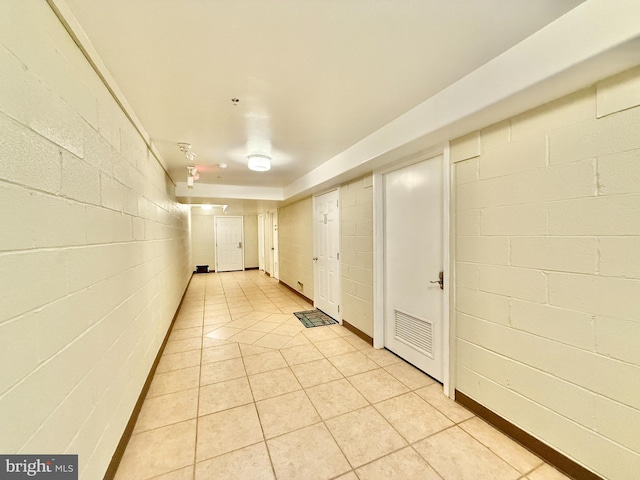 hall with light tile patterned flooring