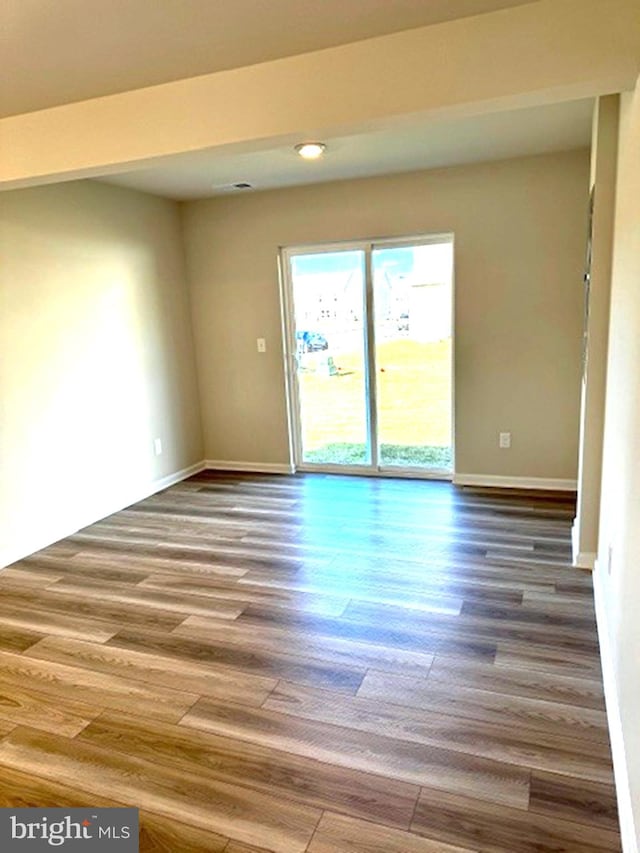 empty room featuring hardwood / wood-style floors