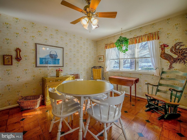 dining space with parquet flooring and ceiling fan