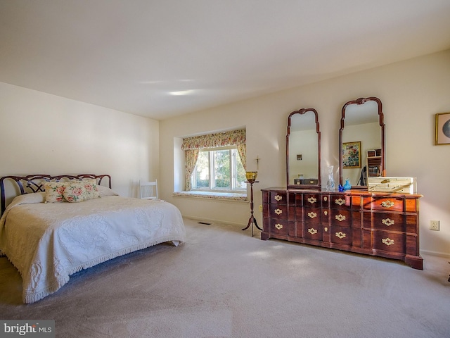 bedroom with light colored carpet