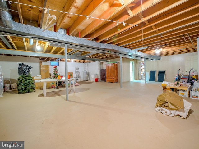 basement featuring electric water heater