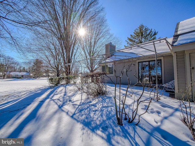 yard layered in snow with cooling unit