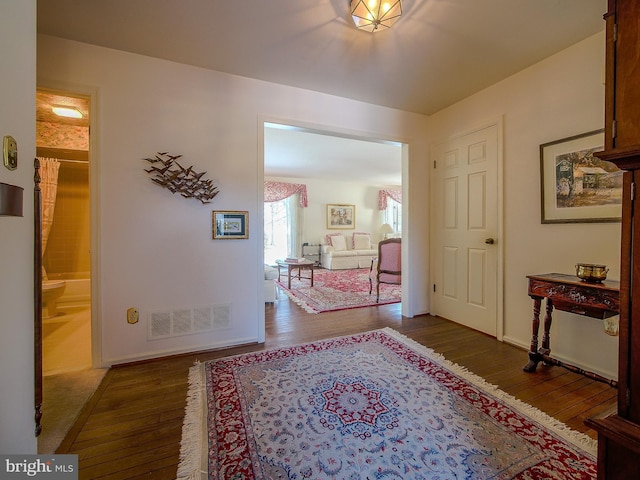 hall with wood-type flooring