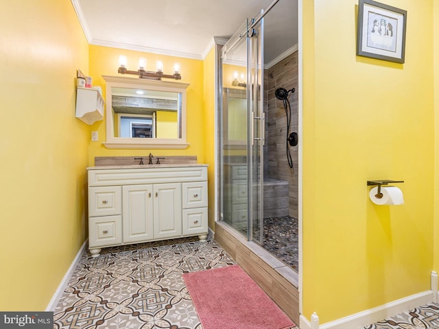 bathroom with a shower with door, ornamental molding, vanity, and tile patterned floors