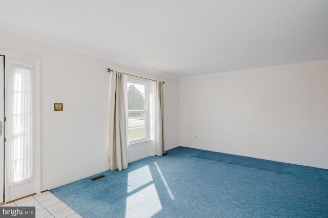 empty room with visible vents, baseboards, light tile patterned flooring, and crown molding