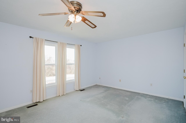 unfurnished room featuring baseboards, visible vents, and carpet floors