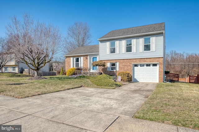 tri-level home featuring a front lawn, concrete driveway, fence, and brick siding