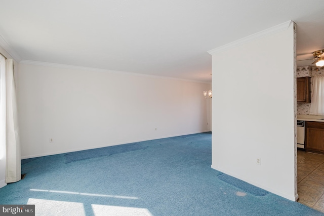 unfurnished room featuring carpet flooring, baseboards, crown molding, and ceiling fan with notable chandelier