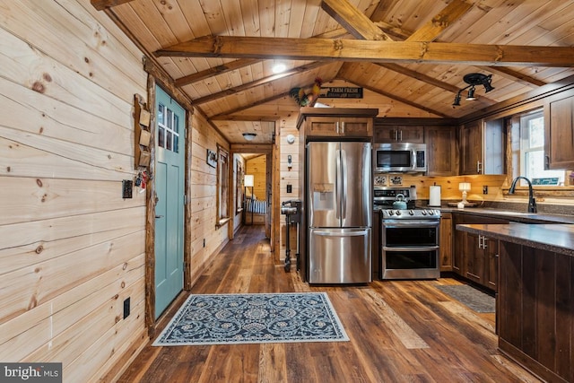 kitchen featuring dark wood-type flooring, dark brown cabinets, wooden walls, stainless steel appliances, and wooden ceiling