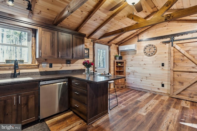 kitchen featuring sink, a breakfast bar area, stainless steel dishwasher, kitchen peninsula, and a wall unit AC