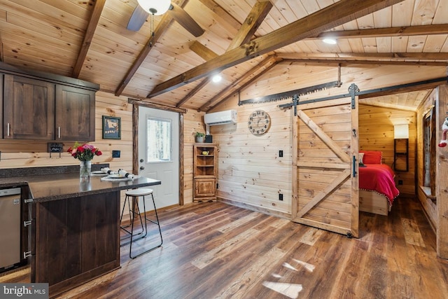 office featuring wooden walls, lofted ceiling with beams, a wall mounted AC, dark hardwood / wood-style flooring, and a barn door