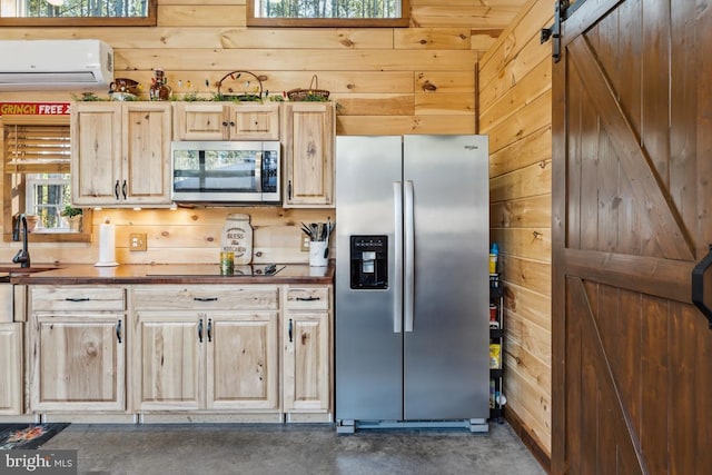 kitchen featuring stainless steel appliances, a wall mounted AC, and wood walls