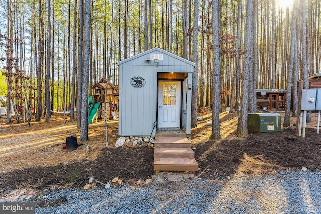 view of outbuilding with a playground