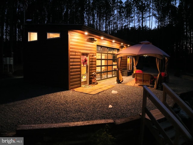 view of outbuilding with a garage and a gazebo