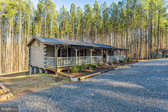 log home with covered porch