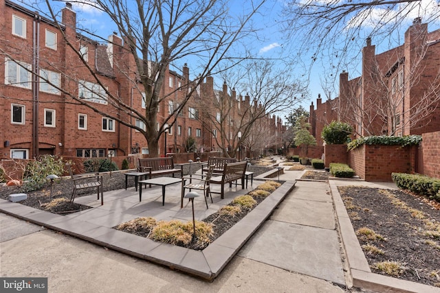 view of property's community featuring a patio area